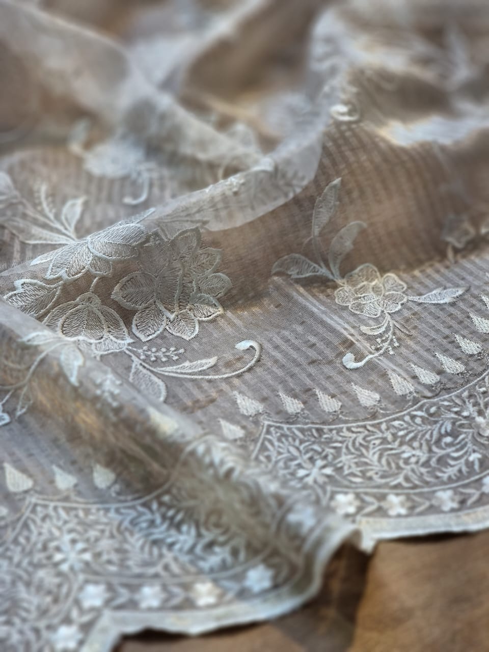 Pure organza silk tissue stripe cutwork jaal embroidery with scallop border and sleeves work in blouse.