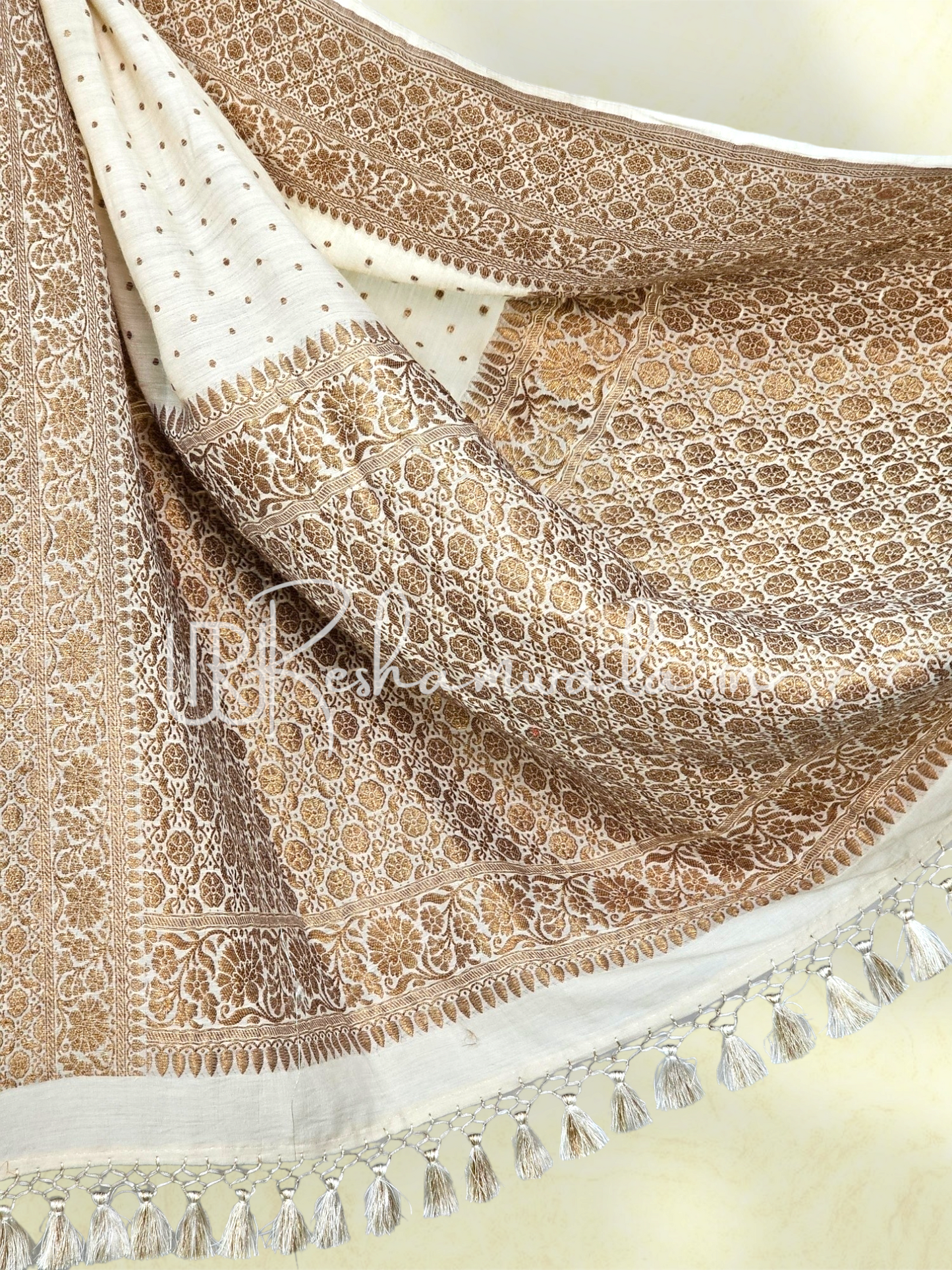 Handwoven Banarasi Pure Munga Silk Saree with antique zari work and heavy tassels with sleeves in blouse